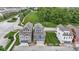 Aerial view of townhomes showcasing a community park, walking paths, and neighborhood feel at 13048 Minden Dr, Fishers, IN 46037