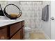 Bathroom featuring a vanity, mirror, and shower-tub combination with decorative shower curtain and a towel at 13048 Minden Dr, Fishers, IN 46037