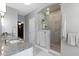 Bathroom with marble countertops, tiled shower and walk in closet at 13048 Minden Dr, Fishers, IN 46037