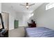 Comfortable bedroom featuring a desk, ceiling fan, and closet space in a well-lit interior at 13048 Minden Dr, Fishers, IN 46037