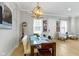 View of the dining room with decoratively framed photos on the wall at 13048 Minden Dr, Fishers, IN 46037