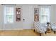 Entryway features hardwood floors and decoratively framed photos on the wall at 13048 Minden Dr, Fishers, IN 46037