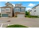 Street view of modern two-story townhomes with brick accents and attached garages in a suburban neighborhood at 13048 Minden Dr, Fishers, IN 46037