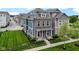 Beautiful two-story home with brick and siding, manicured lawn, and black metal fence at 13048 Minden Dr, Fishers, IN 46037
