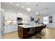 Spacious kitchen with granite island, pendant lighting, stainless steel appliances, and modern cabinetry at 13048 Minden Dr, Fishers, IN 46037