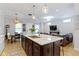 Open concept kitchen features stainless appliances, granite countertops and eat in breakfast area at 13048 Minden Dr, Fishers, IN 46037