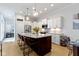Open-concept kitchen with granite countertops, stainless appliances, and seating around a kitchen island at 13048 Minden Dr, Fishers, IN 46037