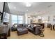 Living room has an open floor plan and flows into the modern kitchen and dining area at 13048 Minden Dr, Fishers, IN 46037