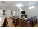 Inviting living room featuring a comfortable leather sofa and abundant natural light at 13048 Minden Dr, Fishers, IN 46037