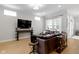 Spacious living room is equipped with hardwood floors, large TV and comfy couch at 13048 Minden Dr, Fishers, IN 46037