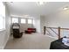 Large upper room featuring a hanging chair, modern furniture, and great natural light from multiple windows at 13048 Minden Dr, Fishers, IN 46037