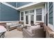 Outdoor patio features comfortable seating, string lights, and access to the home through glass doors at 13048 Minden Dr, Fishers, IN 46037