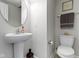 Simple powder room with pedestal sink and toilet at 13048 Minden Dr, Fishers, IN 46037