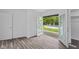French doors lead to a backyard featuring an in-ground pool and a wooden deck with seating at 1311 N Eaton Ave, Indianapolis, IN 46219
