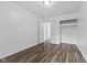 Bedroom featuring closet space and wood-look laminate flooring at 1311 N Eaton Ave, Indianapolis, IN 46219