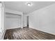 Bedroom featuring a closet with shelving and wood-look floors at 1311 N Eaton Ave, Indianapolis, IN 46219