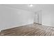 Bright bedroom with white walls and new wood flooring offers a clean and modern feel at 1311 N Eaton Ave, Indianapolis, IN 46219