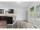 Eat-in kitchen features dark cabinetry, wood countertops and a sliding glass door to the back deck at 1311 N Eaton Ave, Indianapolis, IN 46219