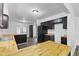 Kitchen features wooden countertops, dark cabinetry, stainless steel appliances and backyard views at 1311 N Eaton Ave, Indianapolis, IN 46219