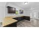 Updated kitchen features wood countertops, stainless steel sink, and view of the backyard at 1311 N Eaton Ave, Indianapolis, IN 46219