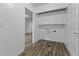 The laundry room includes overhead cabinets and modern washer and dryer hookups at 1311 N Eaton Ave, Indianapolis, IN 46219