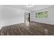 Bright living room featuring wood-look flooring and natural light at 1311 N Eaton Ave, Indianapolis, IN 46219