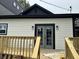 Backyard view from deck with newly renovated house featuring black trim at 1318 Hoyt Ave, Indianapolis, IN 46203