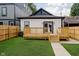 Backyard featuring a wooden deck, grassy area, and privacy fence at 1318 Hoyt Ave, Indianapolis, IN 46203
