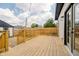 Wooden backyard deck perfect for outdoor entertainment, with a view of the fenced yard at 1318 Hoyt Ave, Indianapolis, IN 46203