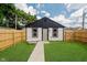 Backyard with green grass, a path, and a tub showcasing the outdoor space at 1318 Hoyt Ave, Indianapolis, IN 46203