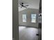 Bright, white bedroom with two windows, vaulted ceiling, ceiling fan and light gray flooring at 1318 Hoyt Ave, Indianapolis, IN 46203