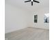 Bedroom with light floors, ceiling fan, and large windows offering ample natural light at 1318 Hoyt Ave, Indianapolis, IN 46203
