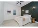 Cozy bedroom with neutral tones, soft lighting, and a comfortable bed at 1318 Hoyt Ave, Indianapolis, IN 46203