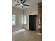 Bedroom featuring light floors, two windows, closet, and exposed brick wall at 1318 Hoyt Ave, Indianapolis, IN 46203