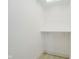 A simple, well-lit closet with ample storage space at 1318 Hoyt Ave, Indianapolis, IN 46203