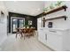 Stylish dining room with modern table set, dark accent wall, and contemporary decor at 1318 Hoyt Ave, Indianapolis, IN 46203