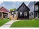 Charming renovated home with striking black and white exterior, modern design, and inviting curb appeal at 1318 Hoyt Ave, Indianapolis, IN 46203