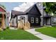 Stylish renovated home with modern black and white exterior, updated facade, and well-manicured lawn at 1318 Hoyt Ave, Indianapolis, IN 46203