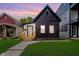 Charming home exterior with a well-manicured lawn, inviting entrance, and modern design at 1318 Hoyt Ave, Indianapolis, IN 46203