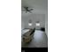 A spacious living room is shown, with new flooring, a ceiling fan, and light-filled windows at 1318 Hoyt Ave, Indianapolis, IN 46203