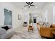 Comfortable living room featuring modern decor, ceiling fan, open floor plan, and natural light at 1318 Hoyt Ave, Indianapolis, IN 46203