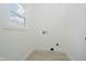 Bright room with hardwood flooring, and a large window offering ample natural light at 1318 Hoyt Ave, Indianapolis, IN 46203
