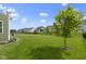 Well-maintained backyard with a green lawn and privacy fence, perfect for outdoor activities and relaxation at 13485 Mancroft Dr, Fishers, IN 46037