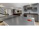 Ping pong table, foosball, and basement bar with granite countertops and a beverage refrigerator at 13485 Mancroft Dr, Fishers, IN 46037