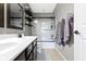 Bathroom with a double sink vanity, decorative mirror, and a shower-tub combo at 13485 Mancroft Dr, Fishers, IN 46037