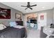 Cozy bedroom featuring a ceiling fan, comfortable bed, and gray walls for a relaxing ambiance at 13485 Mancroft Dr, Fishers, IN 46037