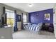 Youthful bedroom features a sports-themed decor, gray walls, and a cozy bed next to a window at 13485 Mancroft Dr, Fishers, IN 46037
