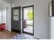 Light and airy entryway featuring a decorative front door and a view of the landscaped front yard at 13485 Mancroft Dr, Fishers, IN 46037
