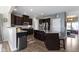 Spacious kitchen with dark wood cabinetry, stainless appliances, and a convenient island for meal prep at 13485 Mancroft Dr, Fishers, IN 46037