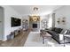 Inviting living room with stone fireplace, large TV, comfortable seating, and stylish decor at 13485 Mancroft Dr, Fishers, IN 46037